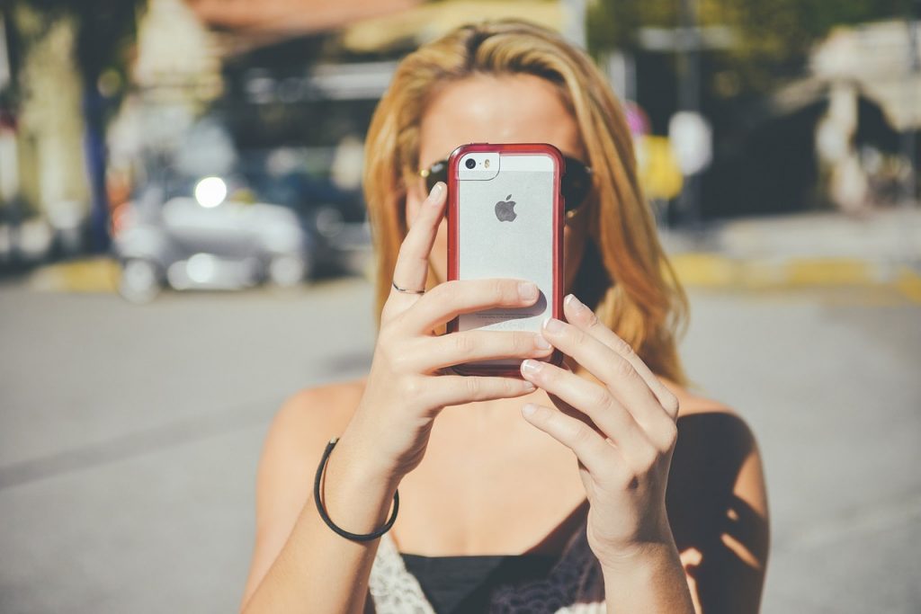 Person storing iPhone pictures in the cloud