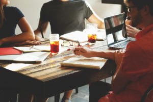 Employees collaborating using cloud technology